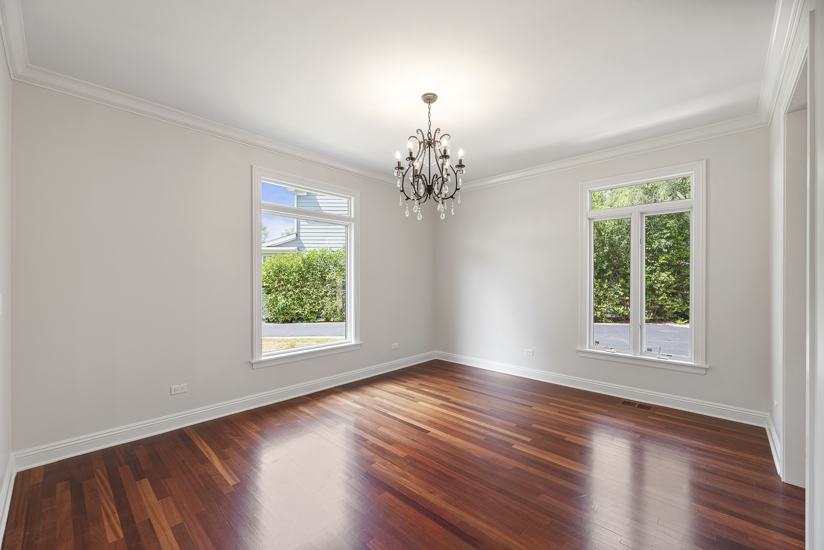 701 Ridge Road Highland Park, IL 60035 - Photo 5 of 60 a view of an empty room with wooden floor and a window