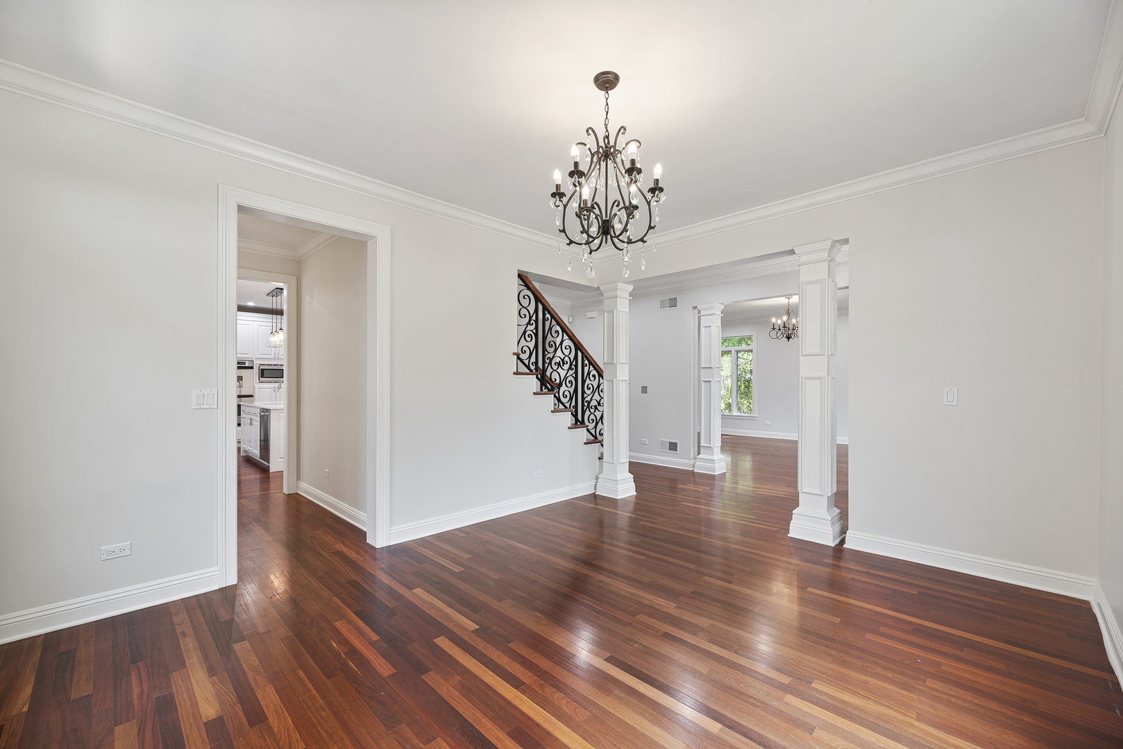 701 Ridge Road Highland Park, IL 60035 - Photo 6 of 60 a view of a hallway with wooden floor and staircase