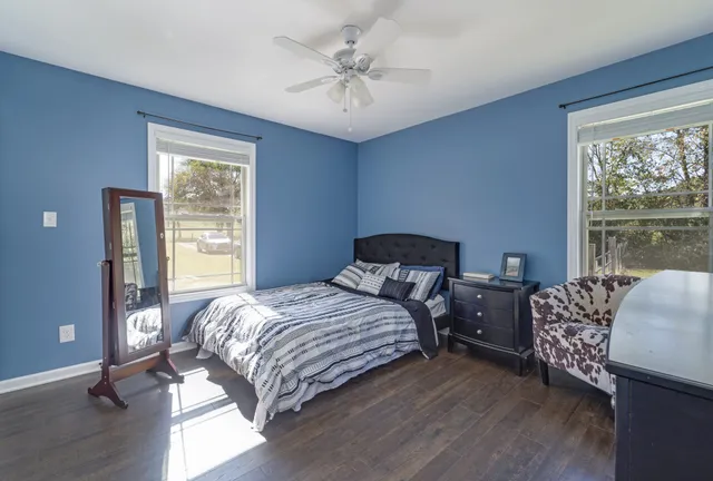 a bedroom with a bed and a couch