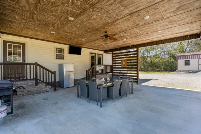 a view of a patio with furniture