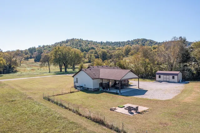 an aerial view of a house with outdoor space