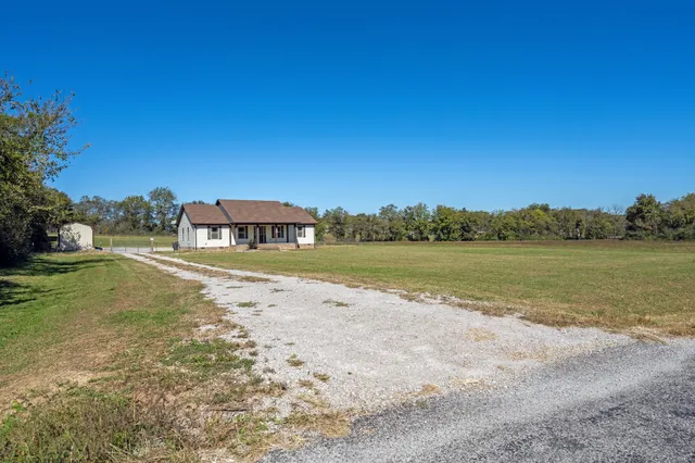 a view of a lake with a house in the background