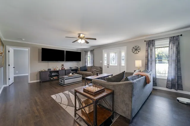 a living room with furniture and a flat screen tv