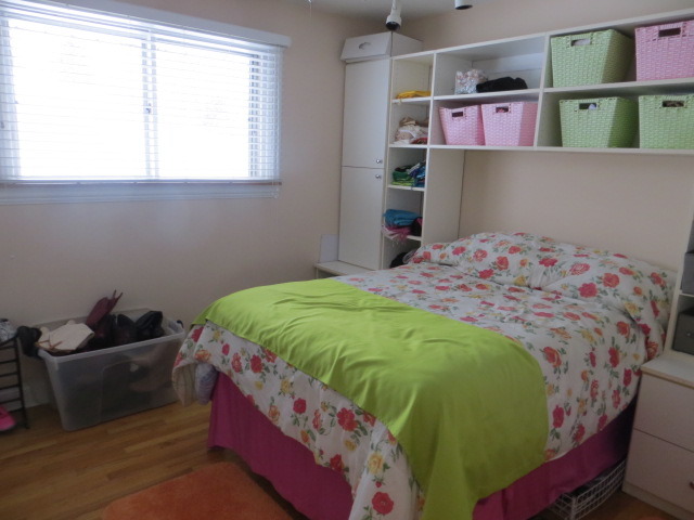 131 East Millers Road Des Plaines, IL 60016 - Photo 8 of 10 a bedroom with a bed and wooden floor