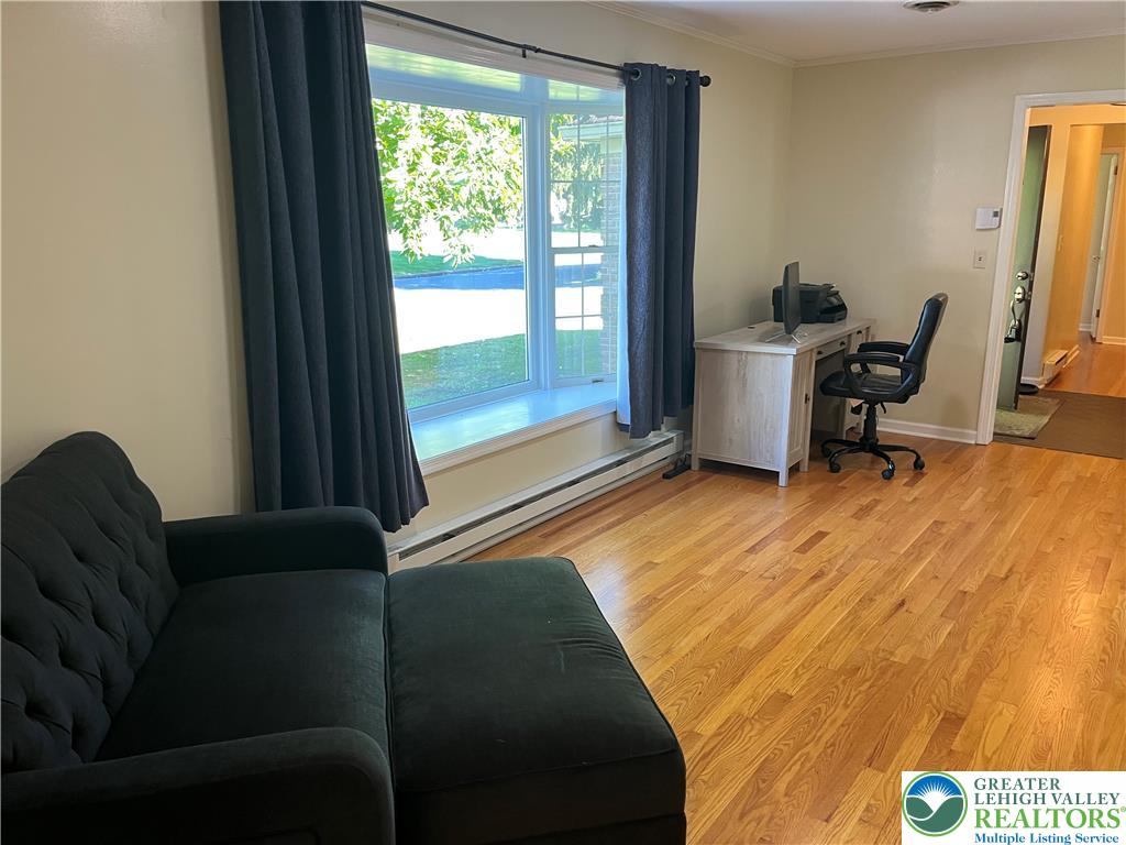 6221 Dove Drive Bethlehem, PA 18017 - Photo 13 of 38 Warm hardwood floors anchor this versatile living space illuminated by a large bay window.