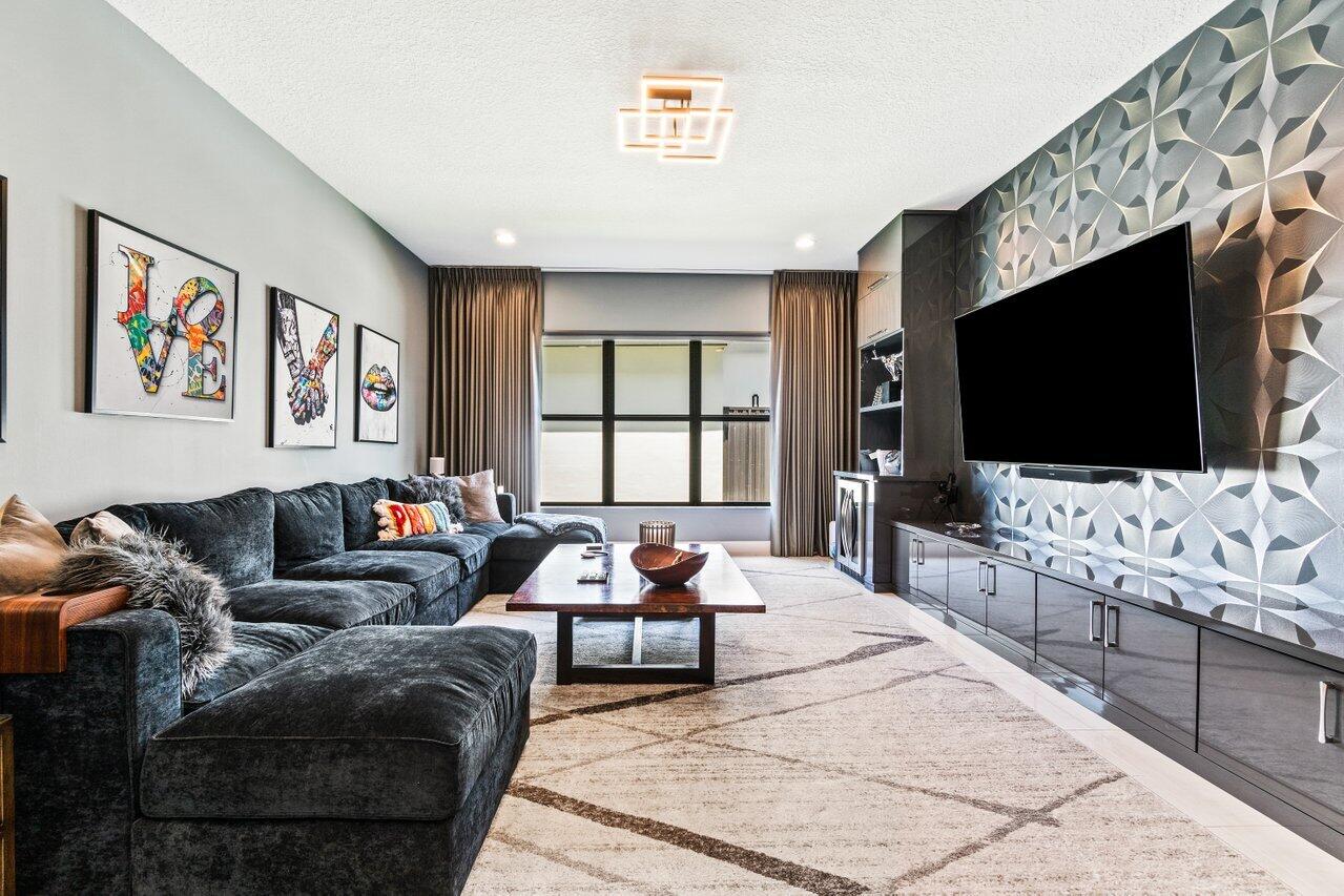 8618 Tower Bridge Court Boca Raton, FL 33496 - Photo 15 of 47 a living room with furniture and a flat screen tv
