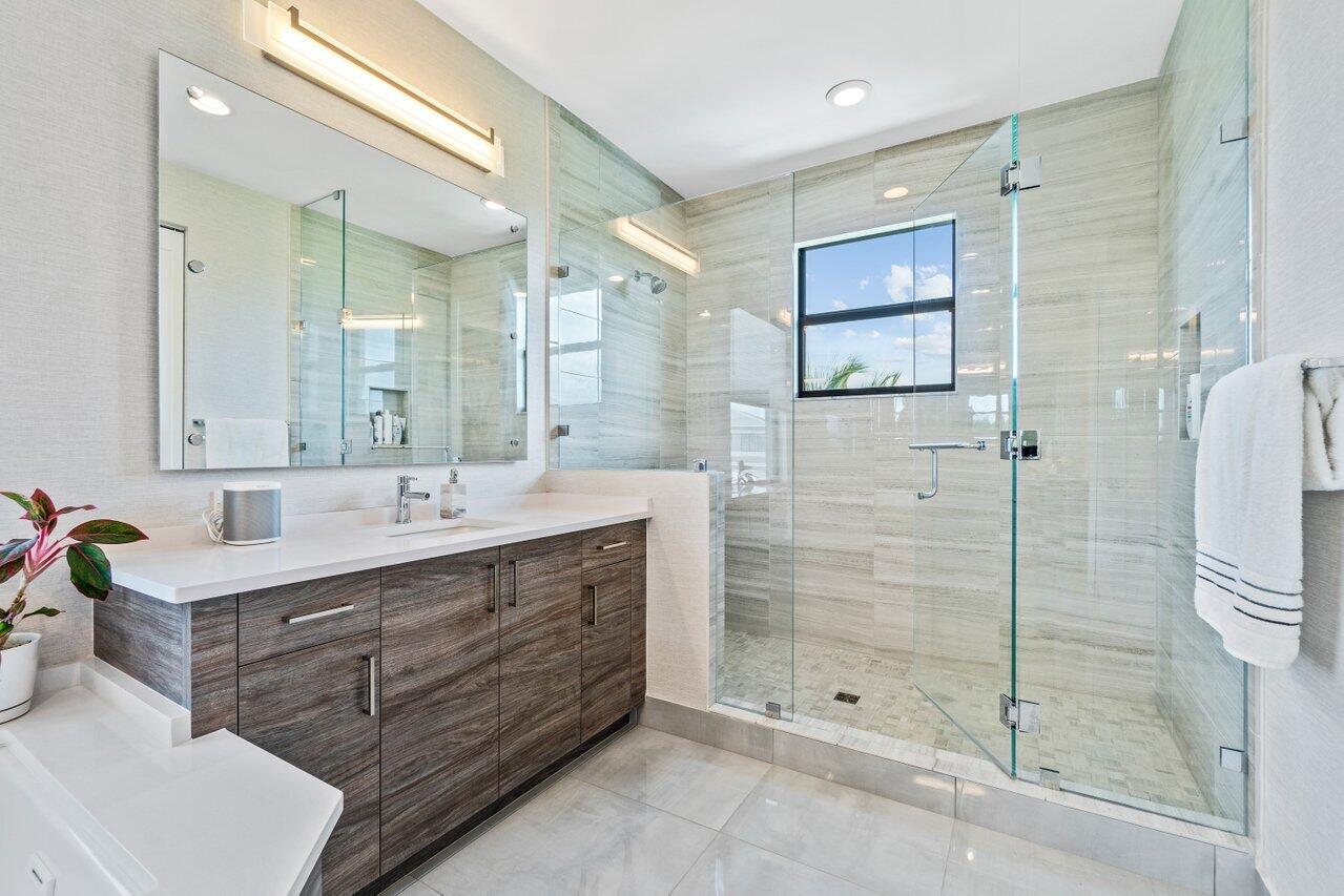 8618 Tower Bridge Court Boca Raton, FL 33496 - Photo 27 of 47 a bathroom with a shower sink and mirror