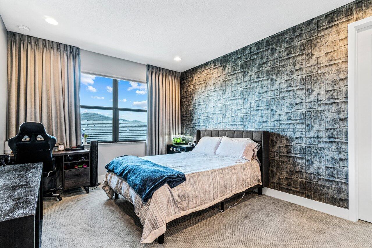 8618 Tower Bridge Court Boca Raton, FL 33496 - Photo 29 of 47 a bedroom with a bed and a dresser next to a window