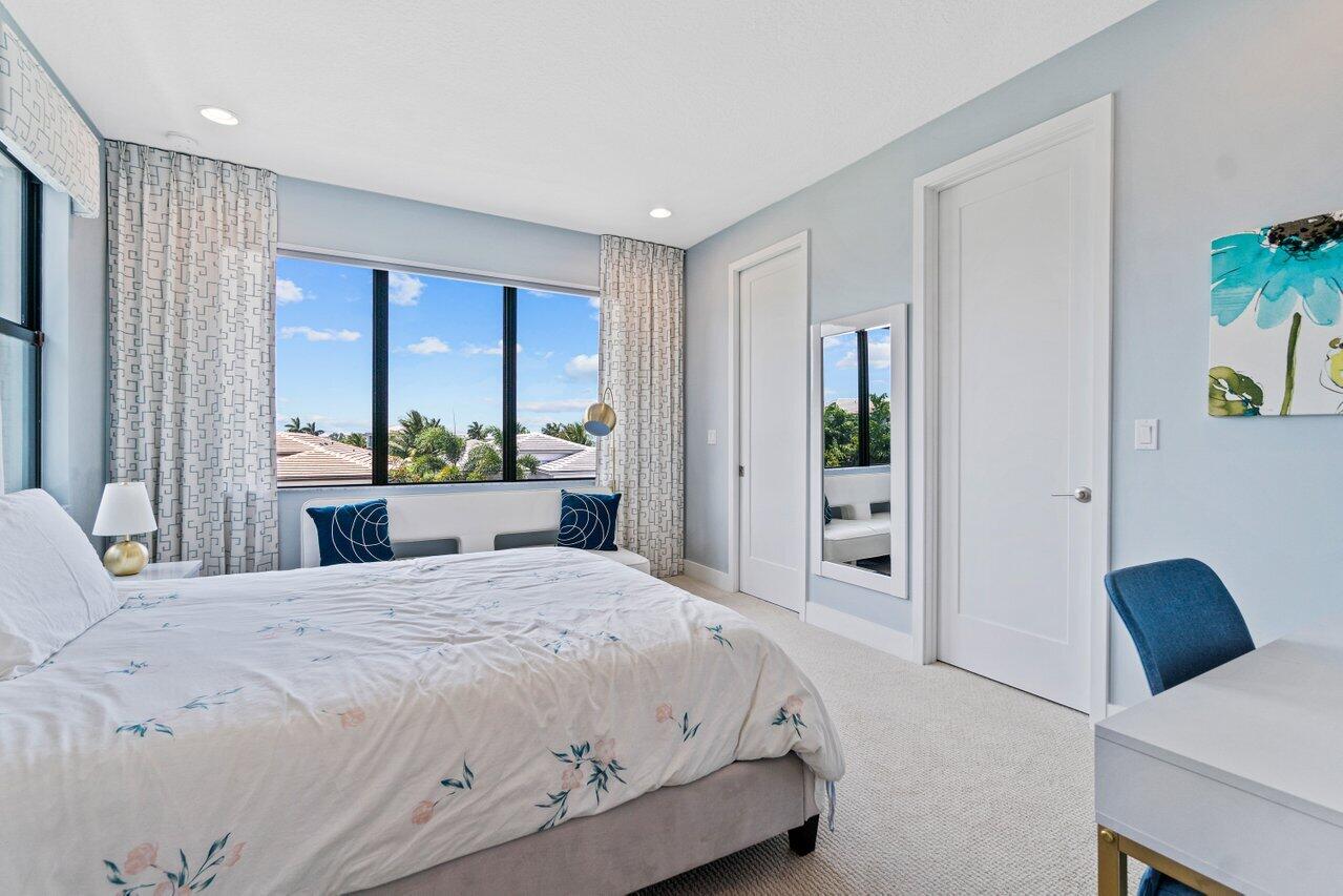 8618 Tower Bridge Court Boca Raton, FL 33496 - Photo 31 of 47 a bedroom with a bed and a large window