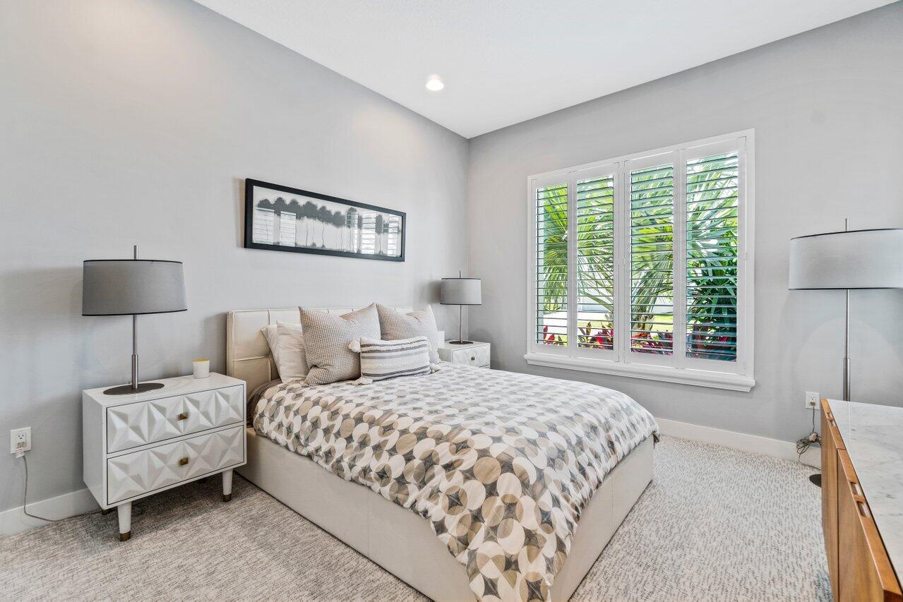 8618 Tower Bridge Court Boca Raton, FL 33496 - Photo 32 of 47 a bedroom with a bed and a night stand