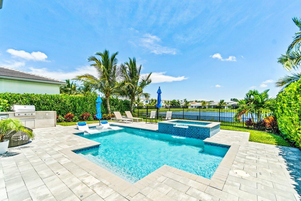 8618 Tower Bridge Court Boca Raton, FL 33496 - Photo 41 of 47 a view of swimming pool with garden and plants