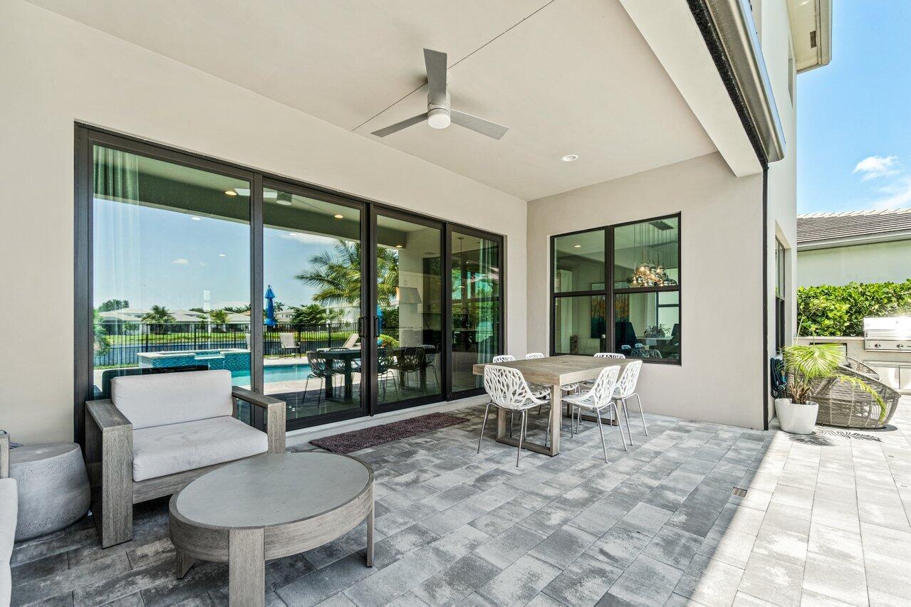 8618 Tower Bridge Court Boca Raton, FL 33496 - Photo 46 of 47 a living room with furniture and a large window