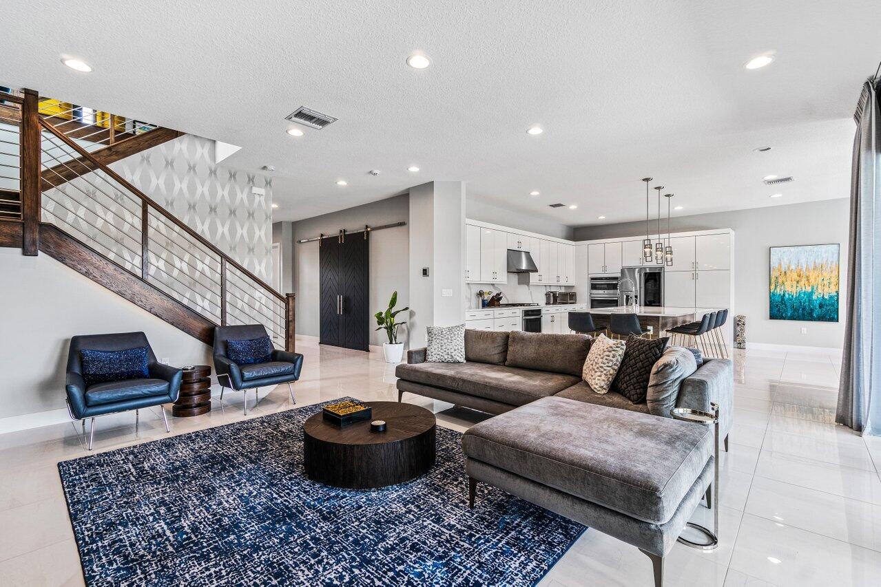 8618 Tower Bridge Court Boca Raton, FL 33496 - Photo 6 of 47 a living room with furniture and a rug