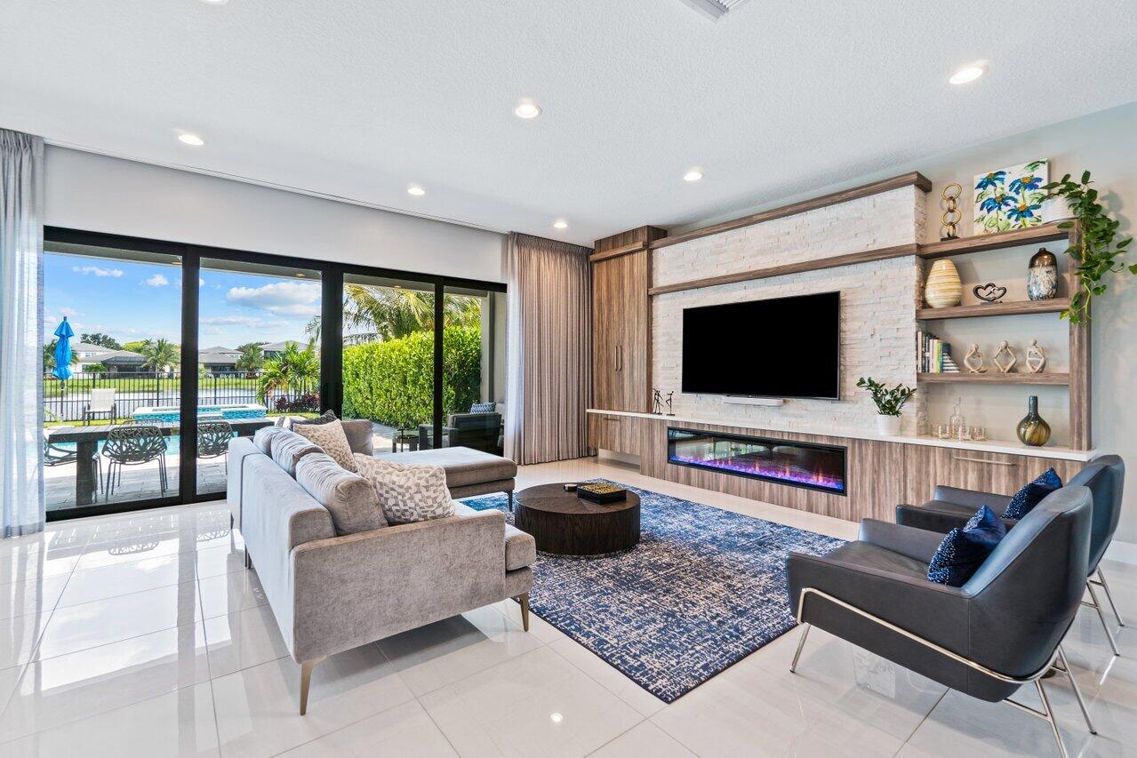 8618 Tower Bridge Court Boca Raton, FL 33496 - Photo 8 of 47 a living room with furniture and a flat screen tv