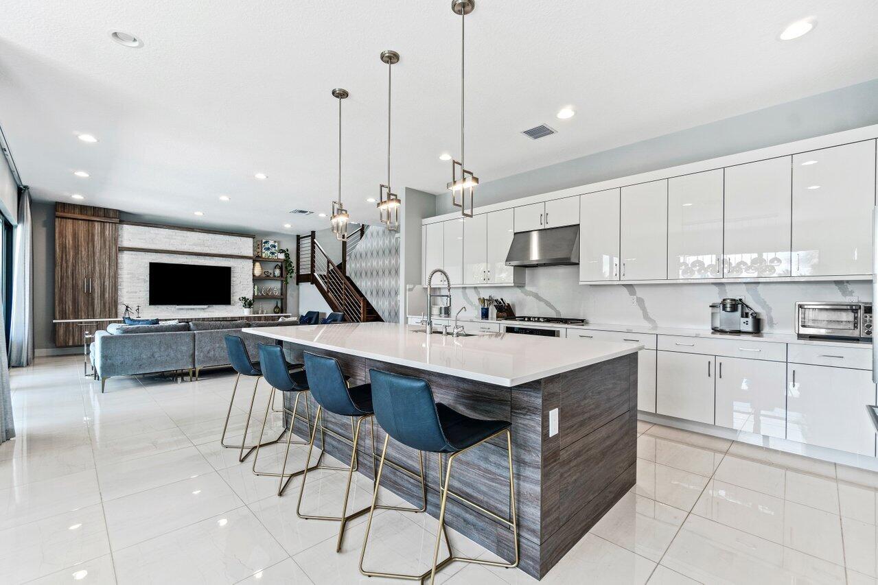 8618 Tower Bridge Court Boca Raton, FL 33496 - Photo 9 of 47 a kitchen with a sink a counter top space and appliances