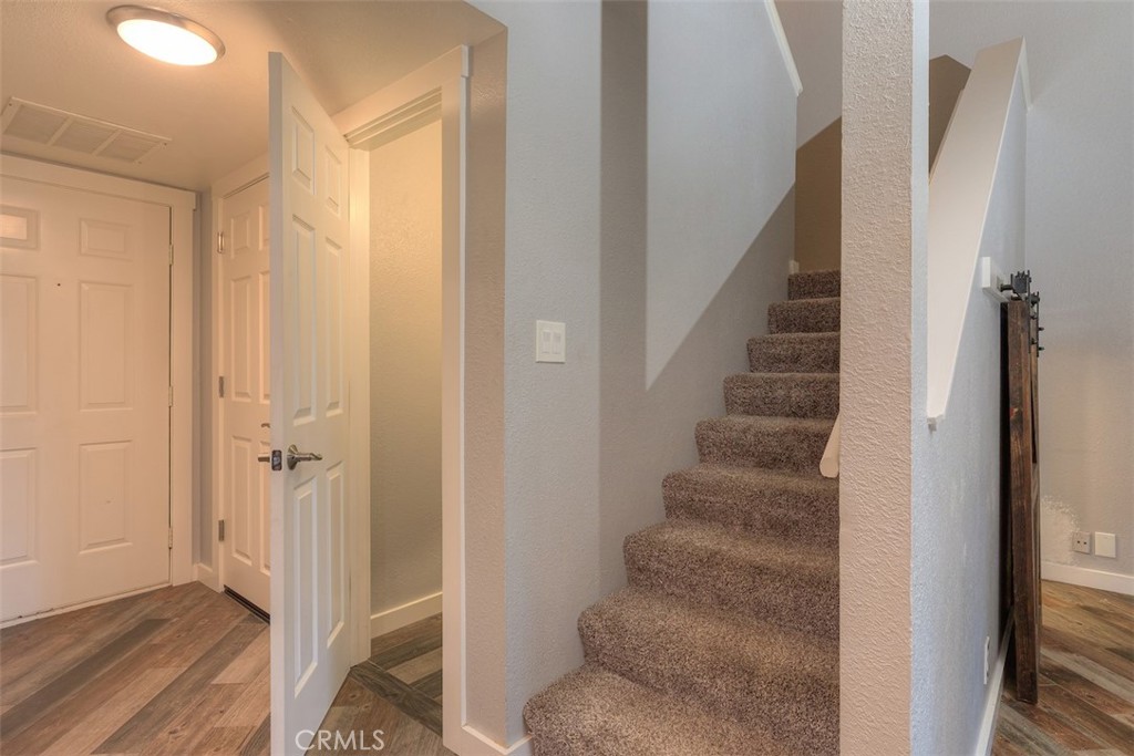 2910 Pennyroyal Drive Chico, CA 95928 - Photo 17 of 41 a view of a hallway with wooden floor and entryway