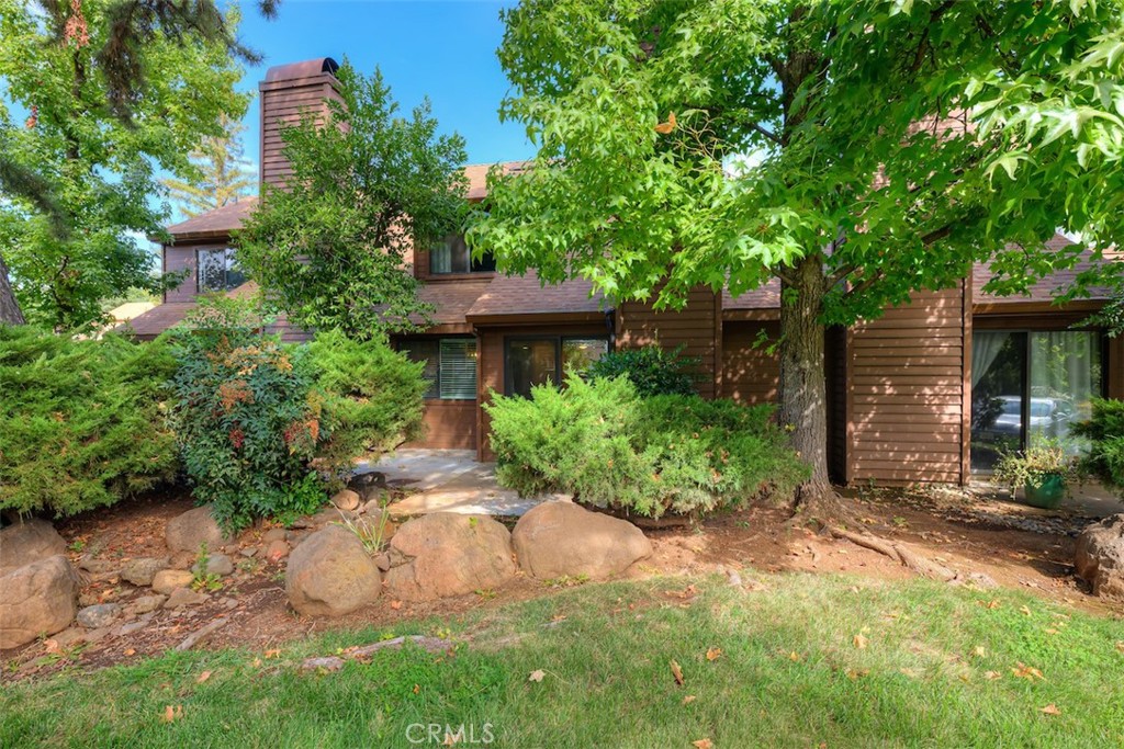 2910 Pennyroyal Drive Chico, CA 95928 - Photo 29 of 41 a view of a back yard with plants and large trees