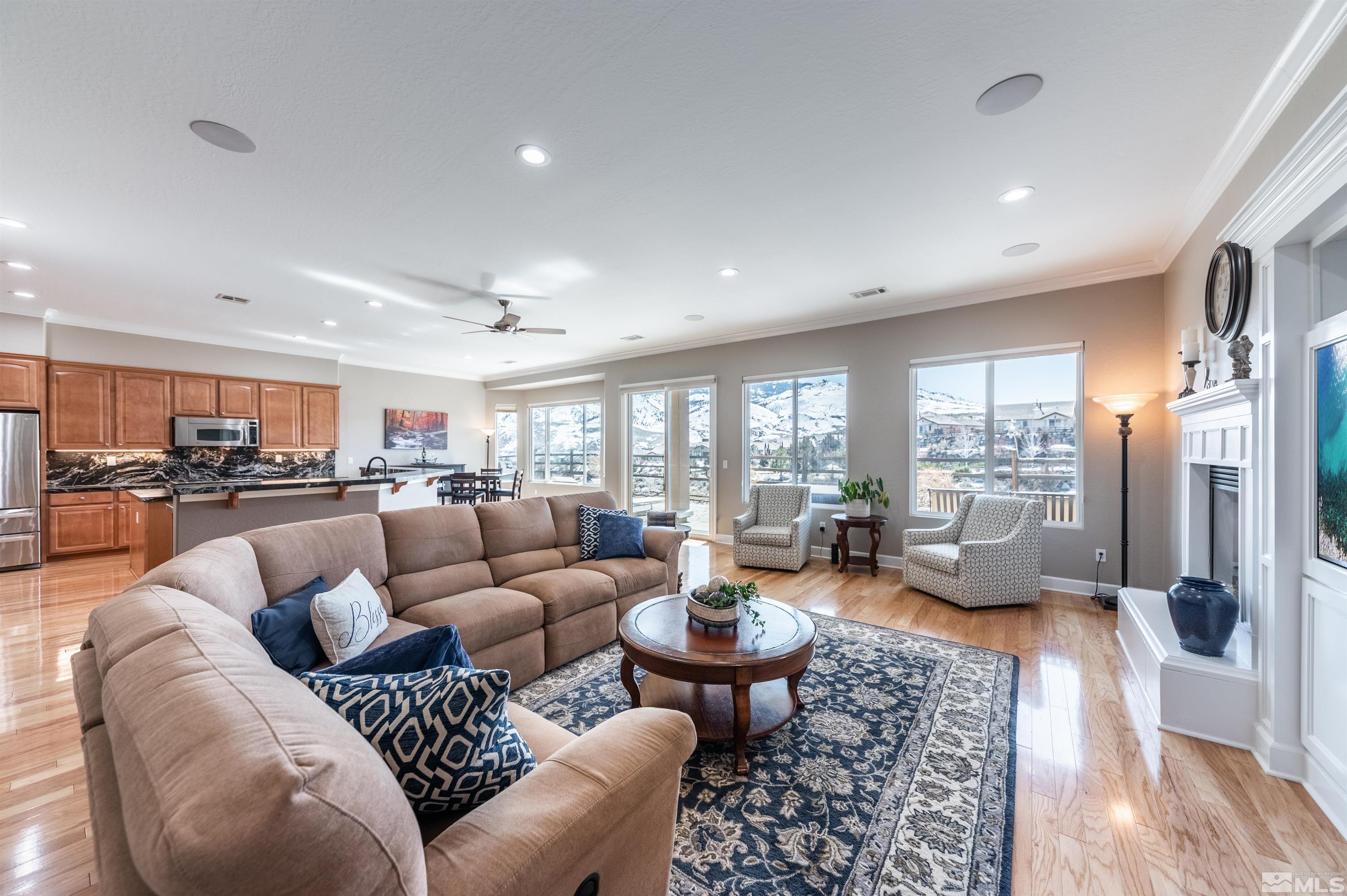 1291 Meridian Ranch Drive Reno, NV 89523 - Photo 12 of 30 a living room with furniture fireplace and a large window