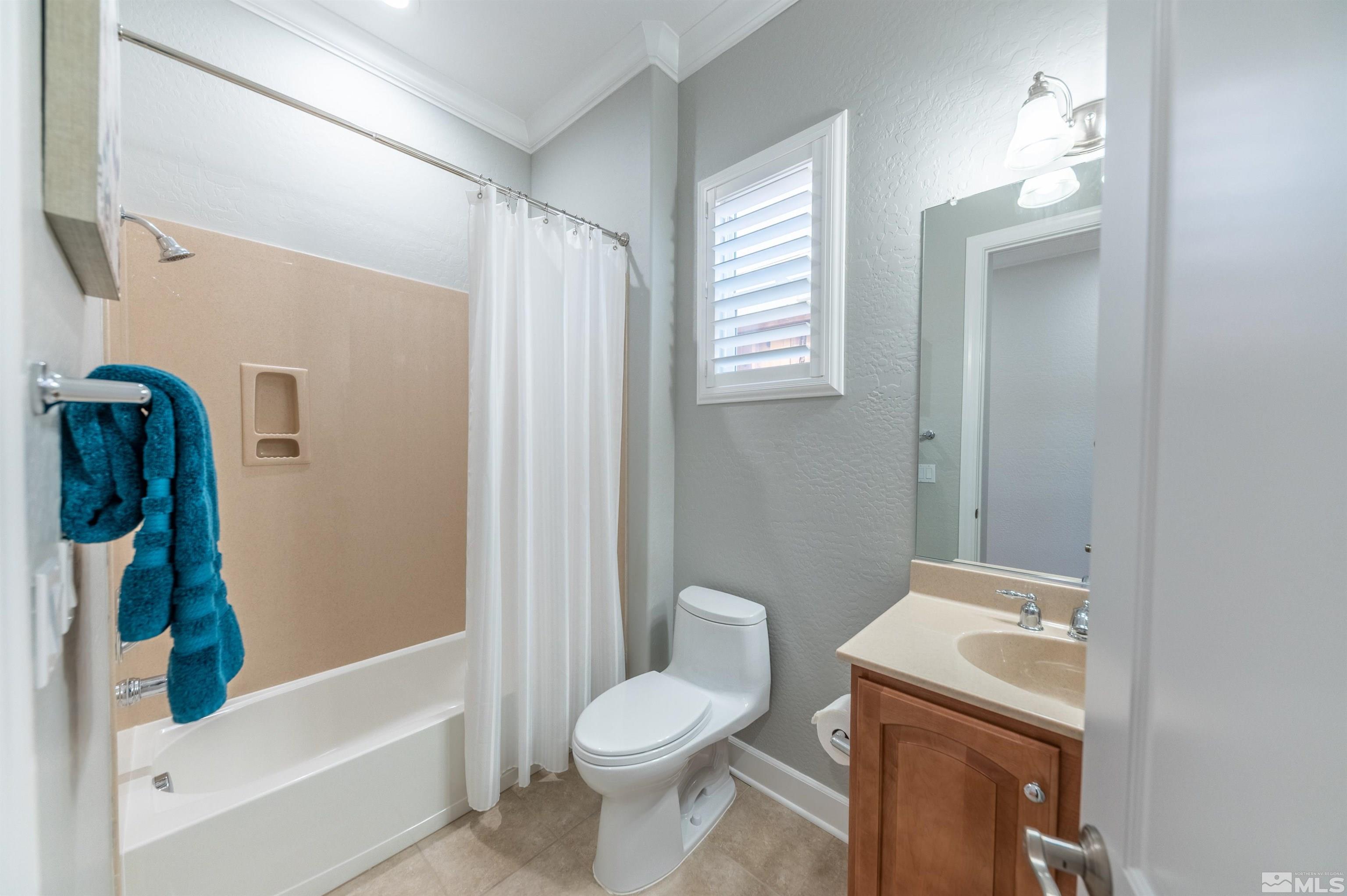 1291 Meridian Ranch Drive Reno, NV 89523 - Photo 16 of 30 a bathroom with a sink a toilet and shower