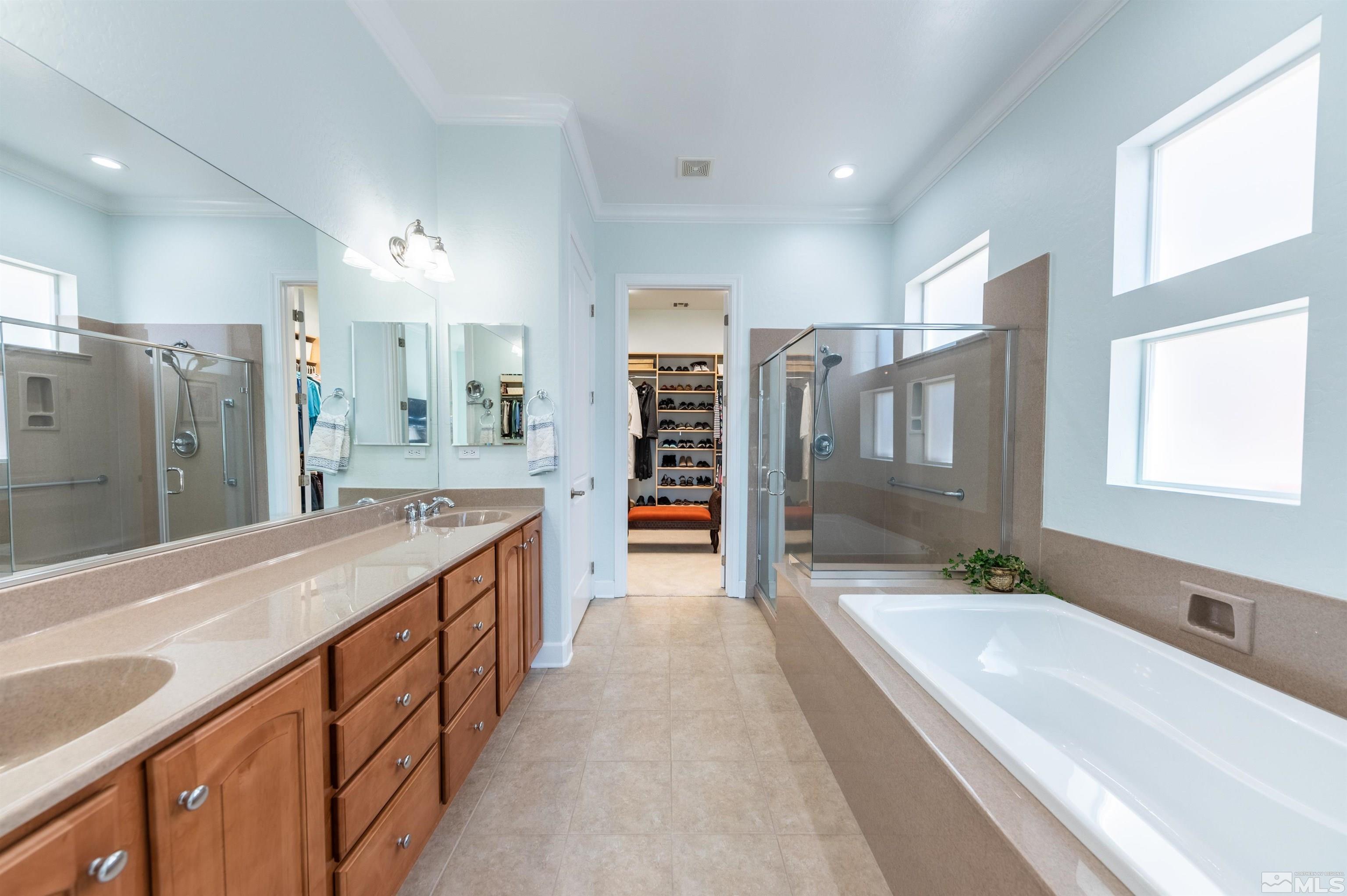 1291 Meridian Ranch Drive Reno, NV 89523 - Photo 20 of 30 a spacious bathroom with a granite countertop sink mirror and shower