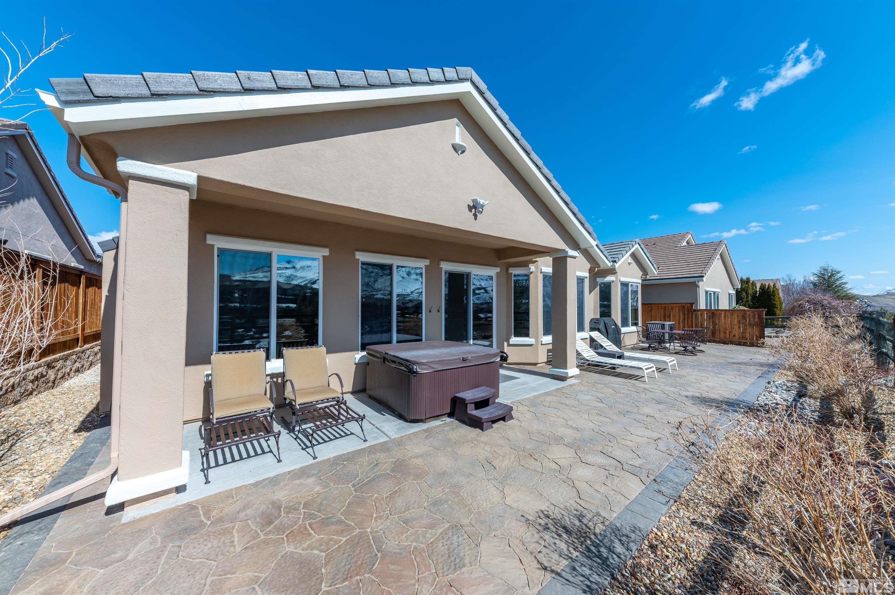 1291 Meridian Ranch Drive Reno, NV 89523 - Photo 25 of 30 a view of a patio with table and chairs and potted plants