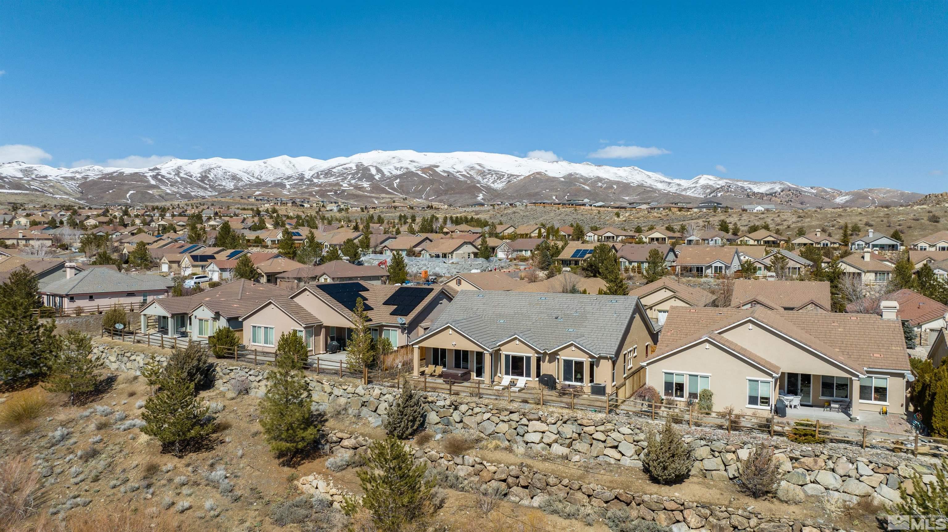 1291 Meridian Ranch Drive Reno, NV 89523 - Photo 28 of 30 a view of a big house with a mountain in the background
