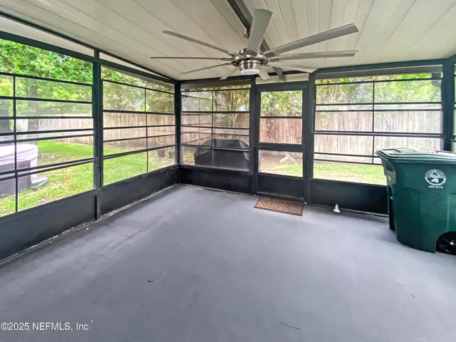 a view of a room with a large window