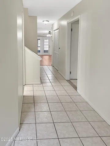 a view of a livingroom with an empty space and a window