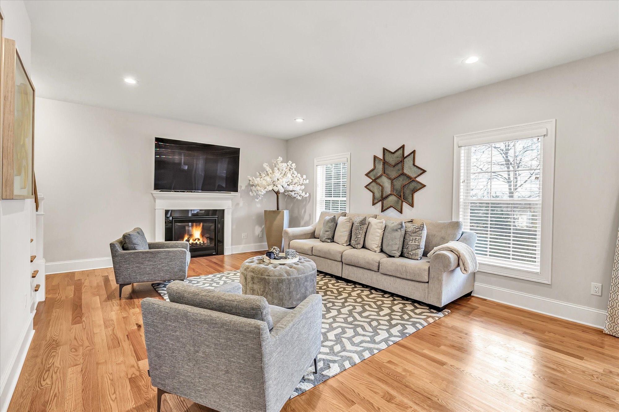 191 Meadow Street Shelton, CT 06484 - Photo 13 of 40 a living room with fireplace furniture and a flat screen tv
