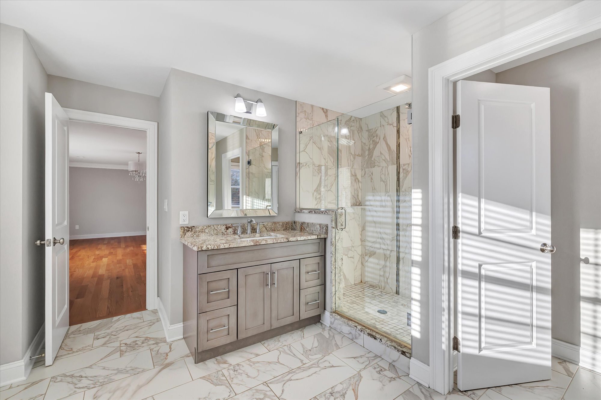 191 Meadow Street Shelton, CT 06484 - Photo 20 of 40 a bathroom with a granite countertop sink a toilet and shower