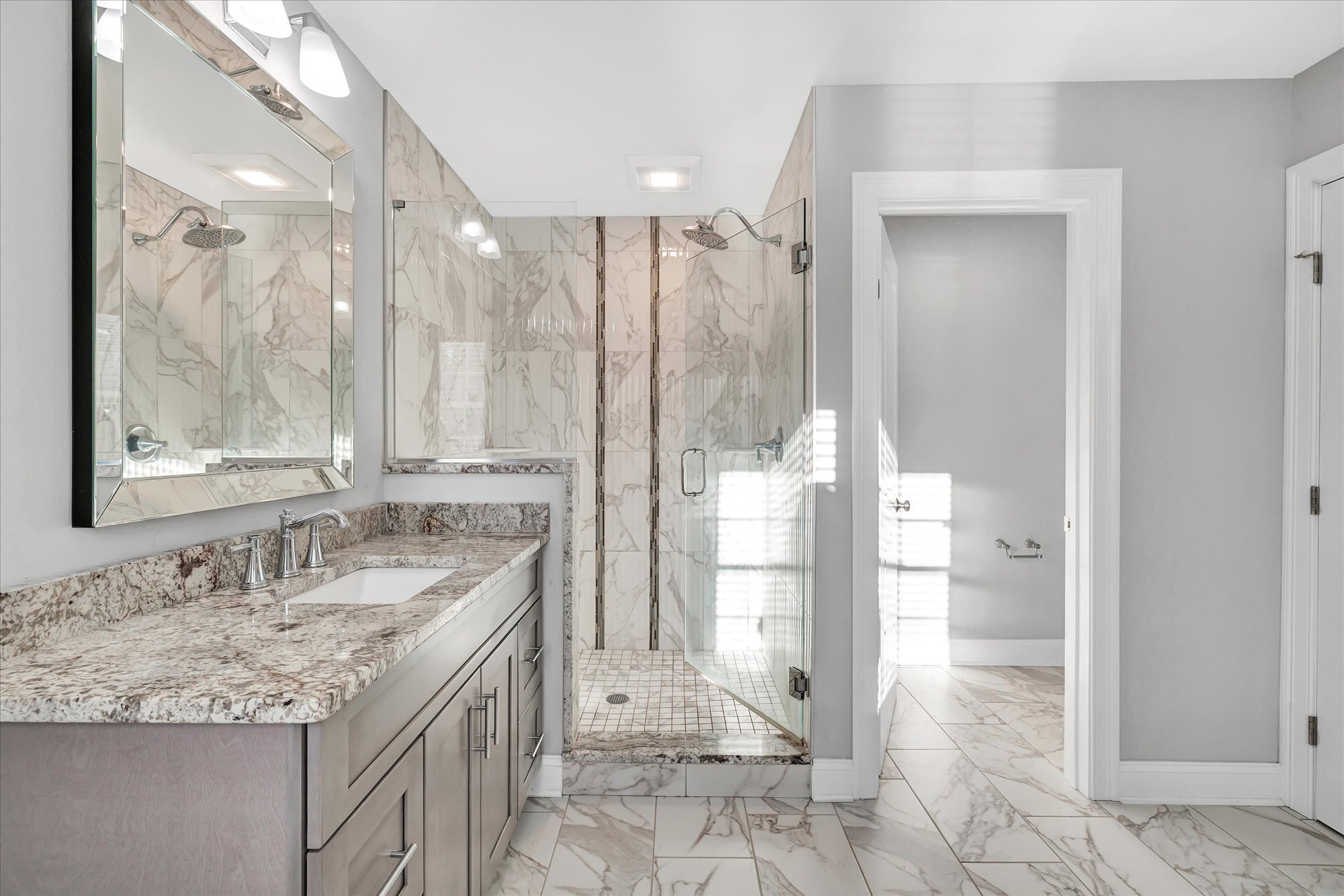 191 Meadow Street Shelton, CT 06484 - Photo 22 of 40 a bathroom with a granite countertop sink and a mirror