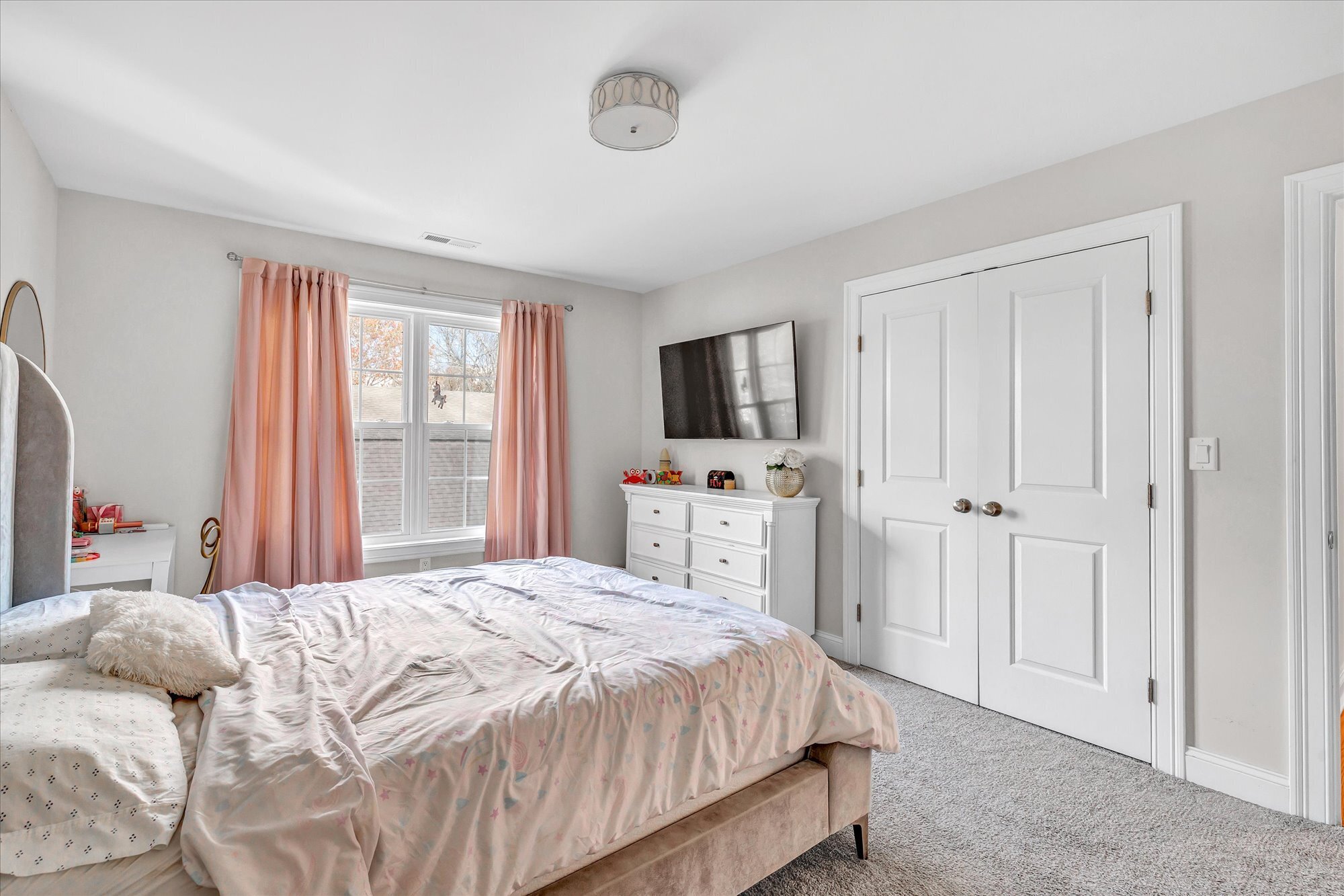 191 Meadow Street Shelton, CT 06484 - Photo 25 of 40 a bedroom with a bed and a flat screen tv