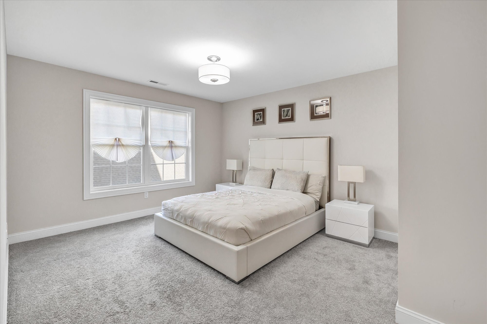 191 Meadow Street Shelton, CT 06484 - Photo 26 of 40 a bed room with a bed and a large window