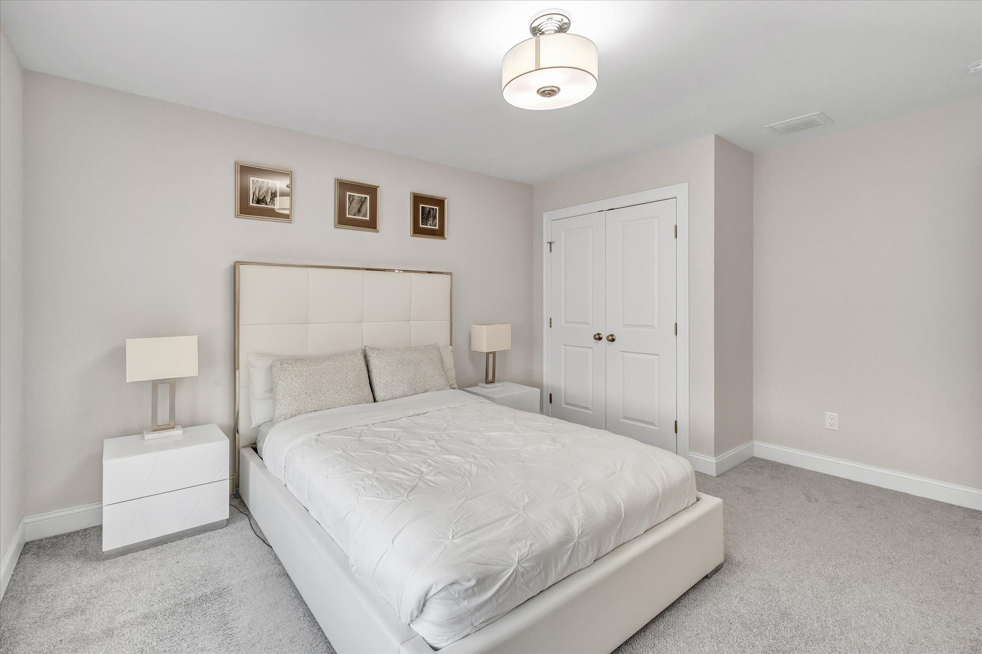 191 Meadow Street Shelton, CT 06484 - Photo 27 of 40 a bedroom with a bed and a night stand