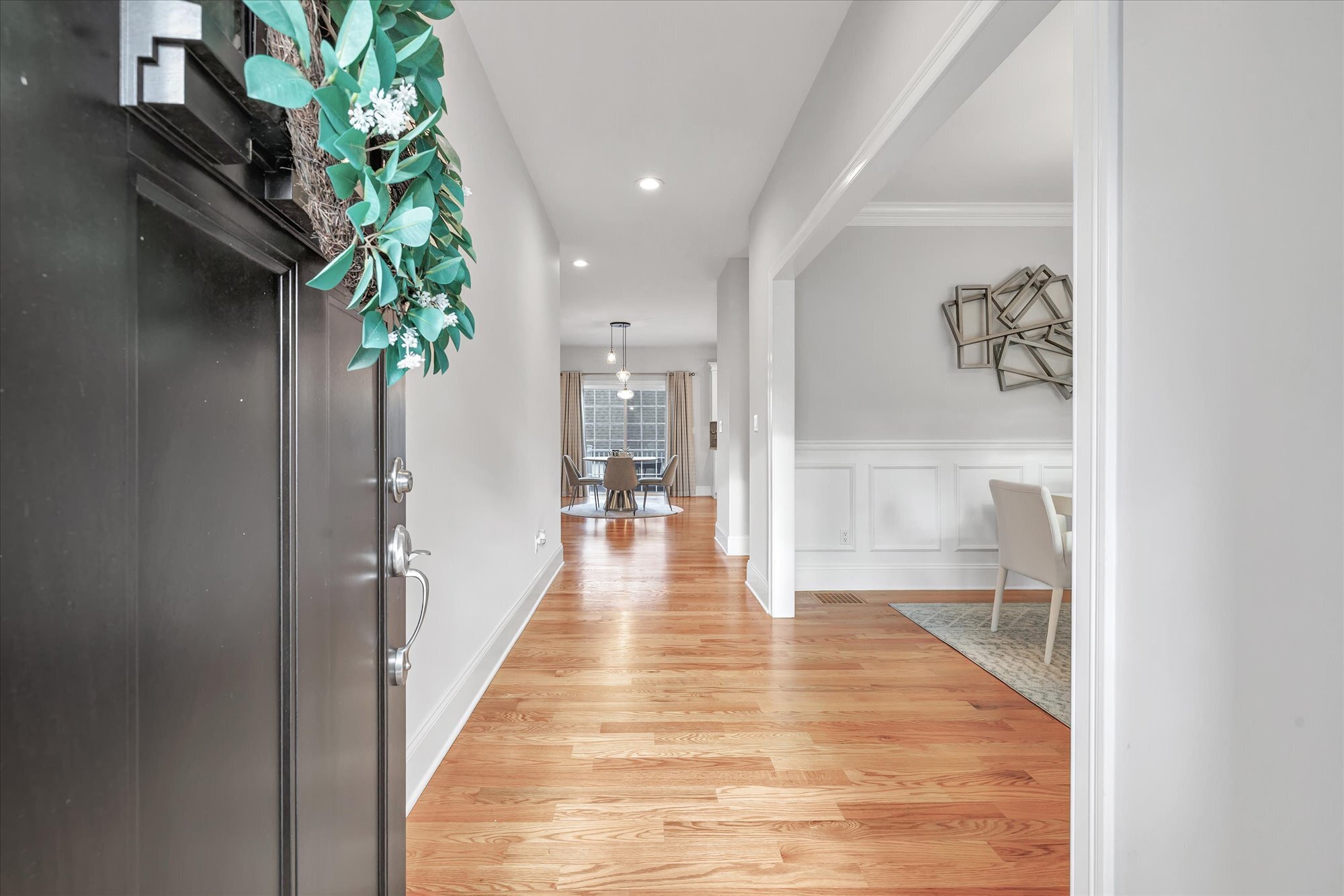 191 Meadow Street Shelton, CT 06484 - Photo 3 of 40 a view of a hallway to a potted plant and livingroom