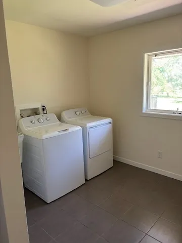 a utility room with dryer and washer