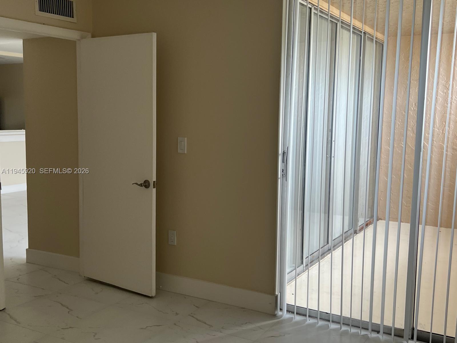 10801 Southwest 109th Court, Unit D110 Miami, FL 33176 - Photo 12 of 25 a view of a bedroom from a hallway