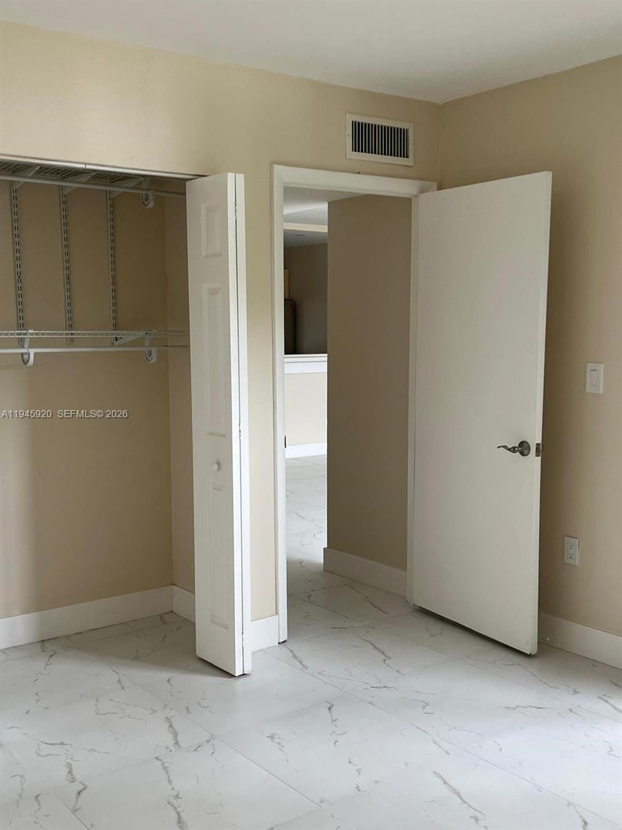 10801 Southwest 109th Court, Unit D110 Miami, FL 33176 - Photo 14 of 25 a view of an empty room