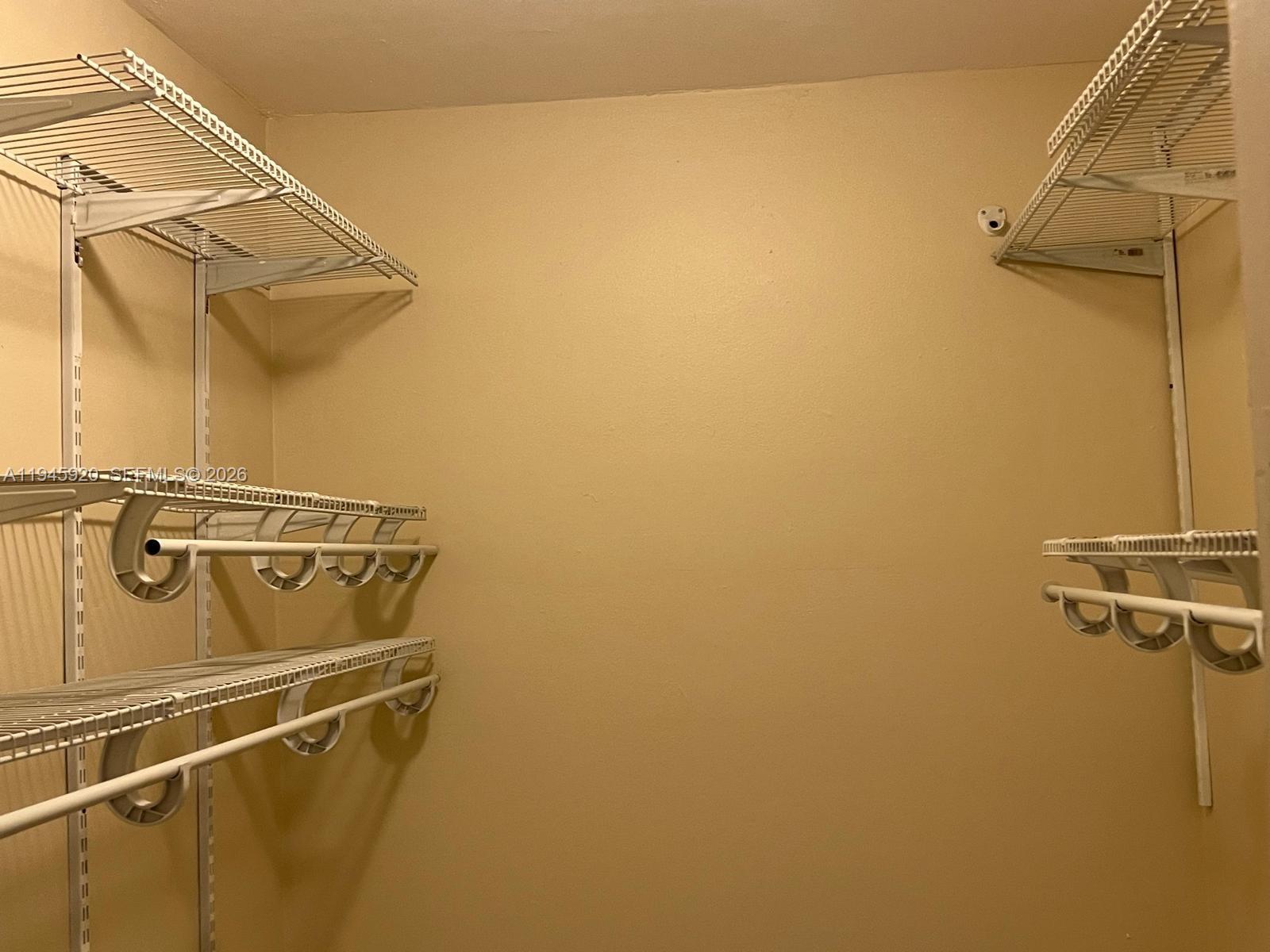 10801 Southwest 109th Court, Unit D110 Miami, FL 33176 - Photo 15 of 25 a close up of a wall with rack on the wall