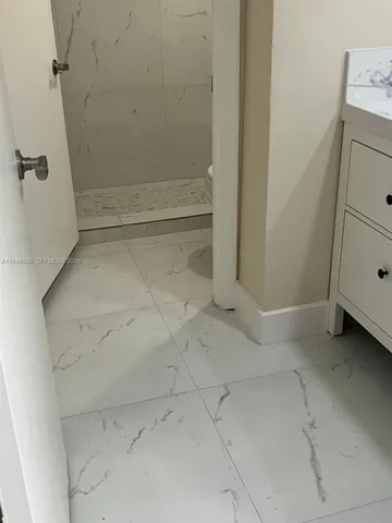 a bathroom with a sink and mirror