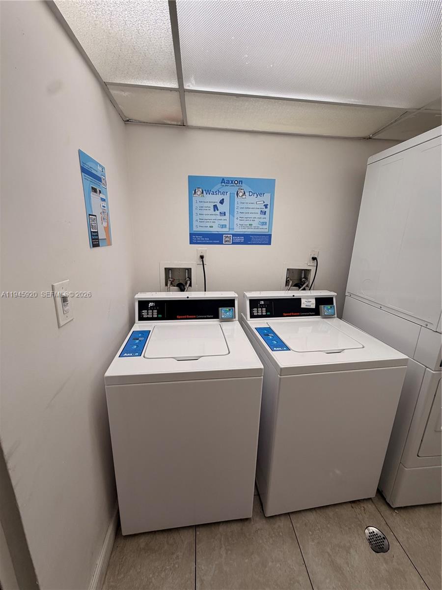 10801 Southwest 109th Court, Unit D110 Miami, FL 33176 - Photo 24 of 25 a utility room with dryer and washer