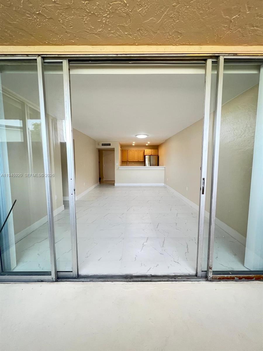 10801 Southwest 109th Court, Unit D110 Miami, FL 33176 - Photo 3 of 25 a view of wooden floor
