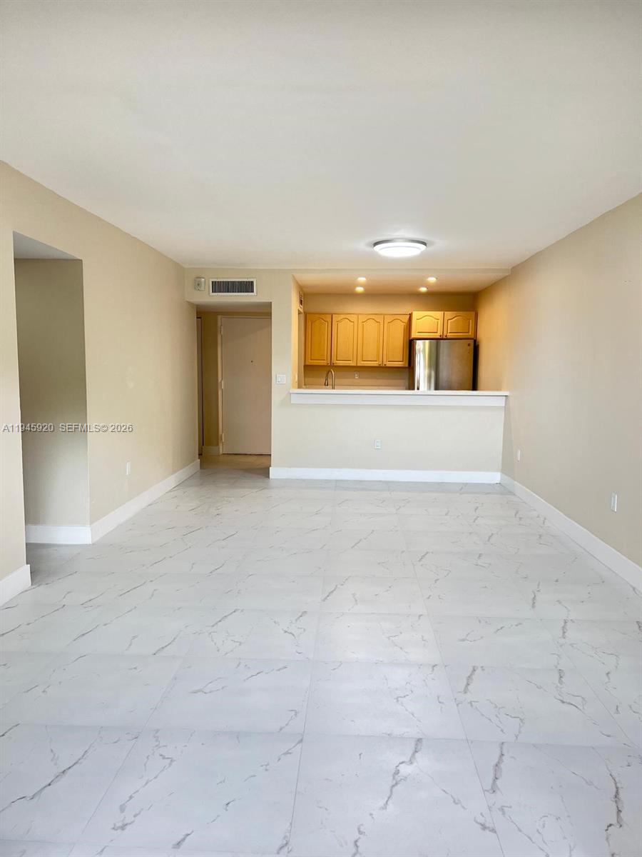 10801 Southwest 109th Court, Unit D110 Miami, FL 33176 - Photo 6 of 25 a view of an empty room with a window