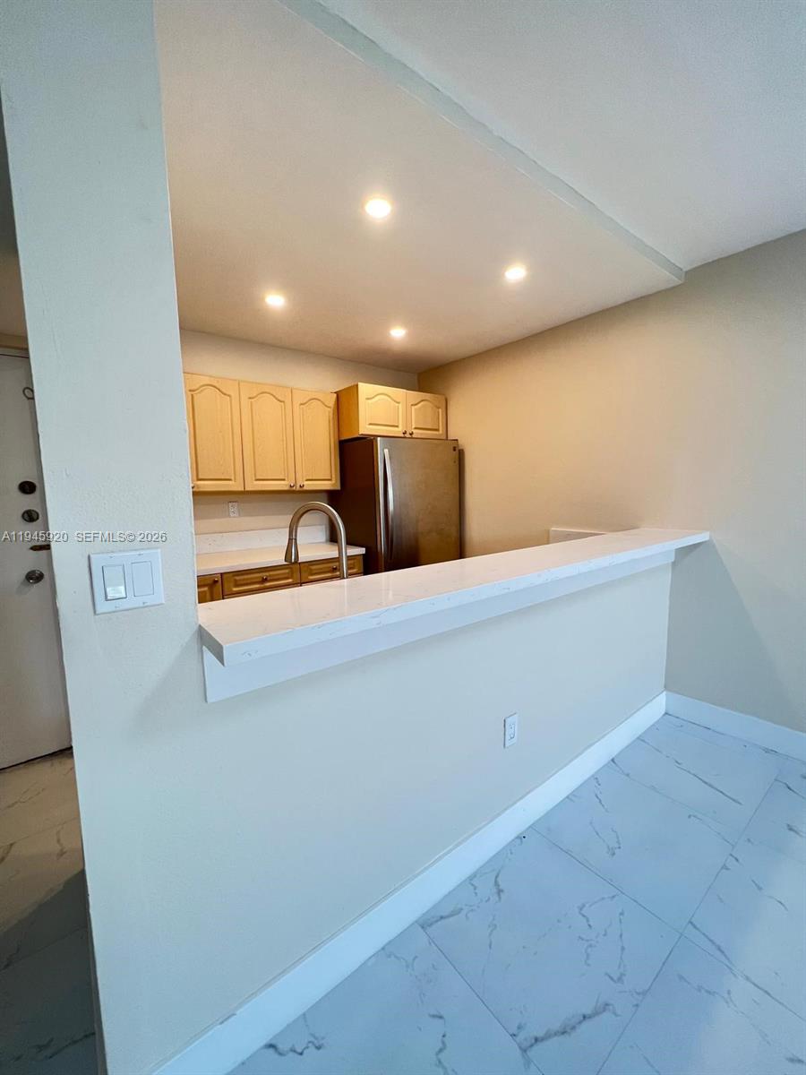 10801 Southwest 109th Court, Unit D110 Miami, FL 33176 - Photo 9 of 25 a view of an empty room with wooden floor