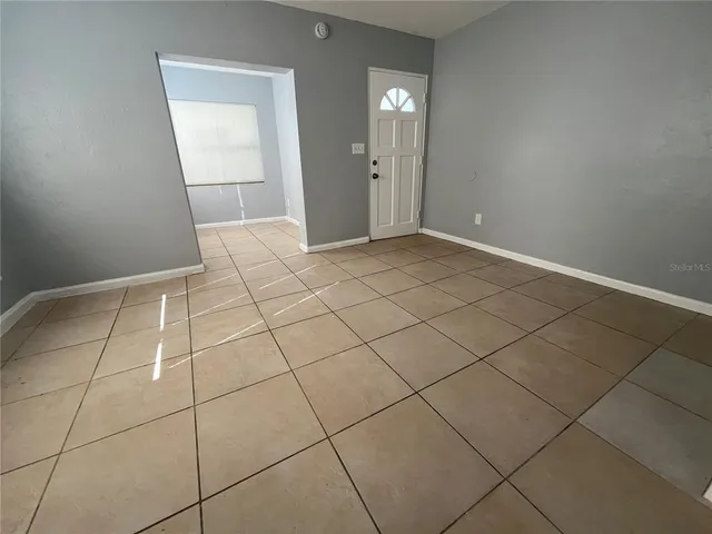 a view of a livingroom and window