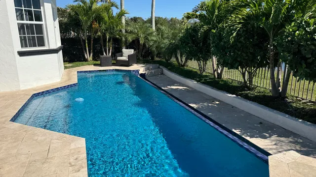 a view of swimming pool with a patio