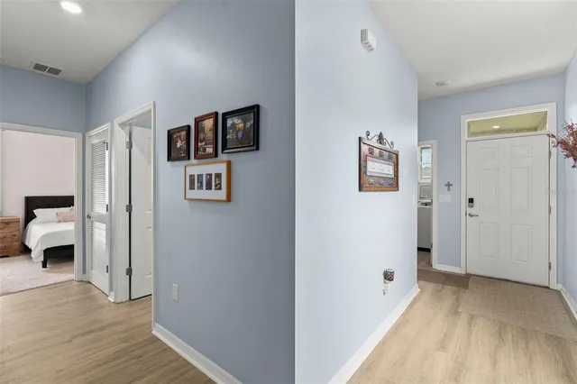 a view of a bedroom with wooden floor and closet