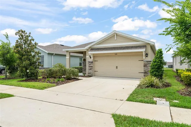 a front view of a house with yard