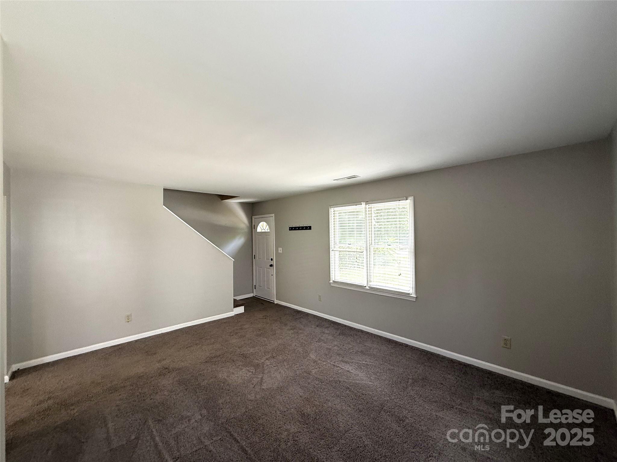 420 Beaty Street Davidson, NC 28036 - Photo 3 of 15 an empty room with windows