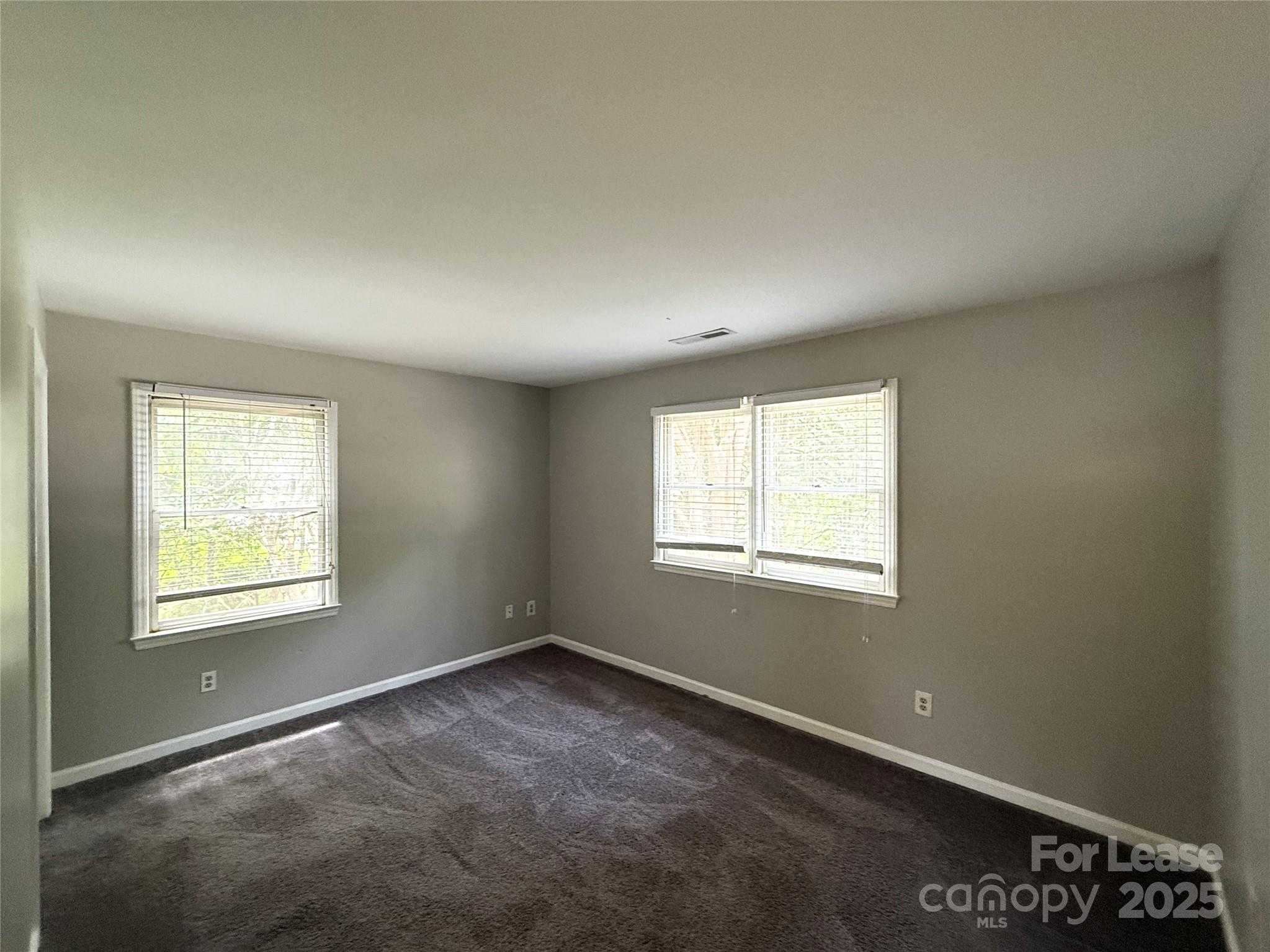 420 Beaty Street Davidson, NC 28036 - Photo 6 of 15 an empty room with a window